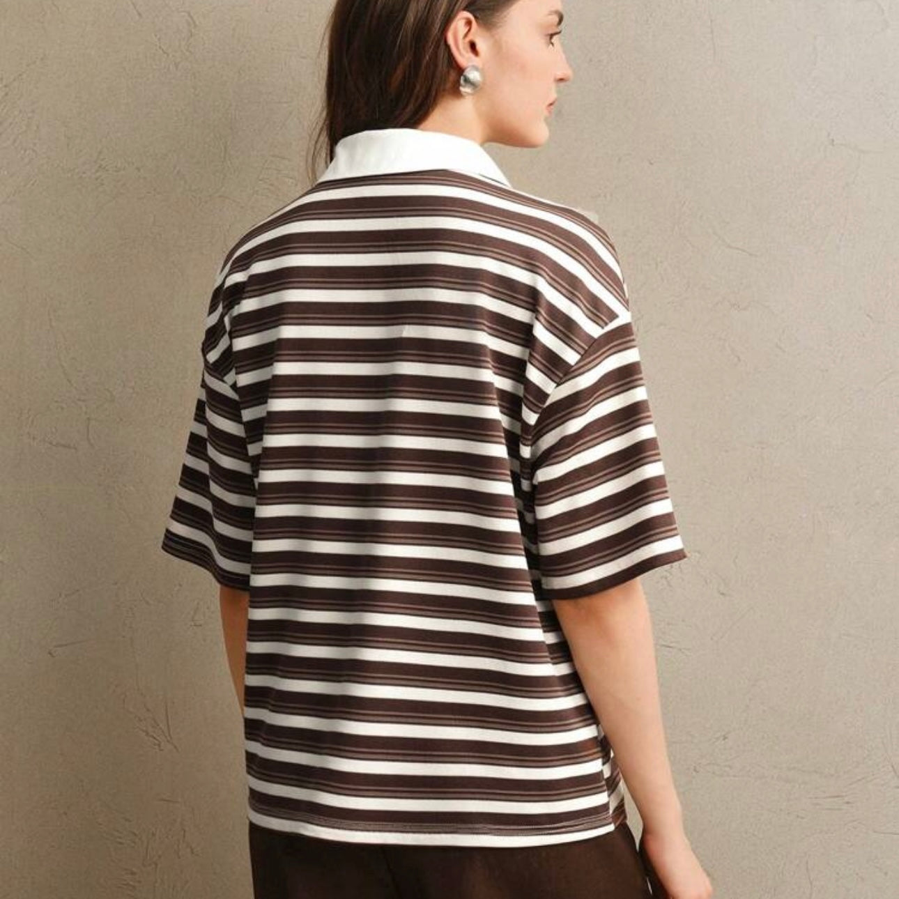 Polo de rayas con detalles